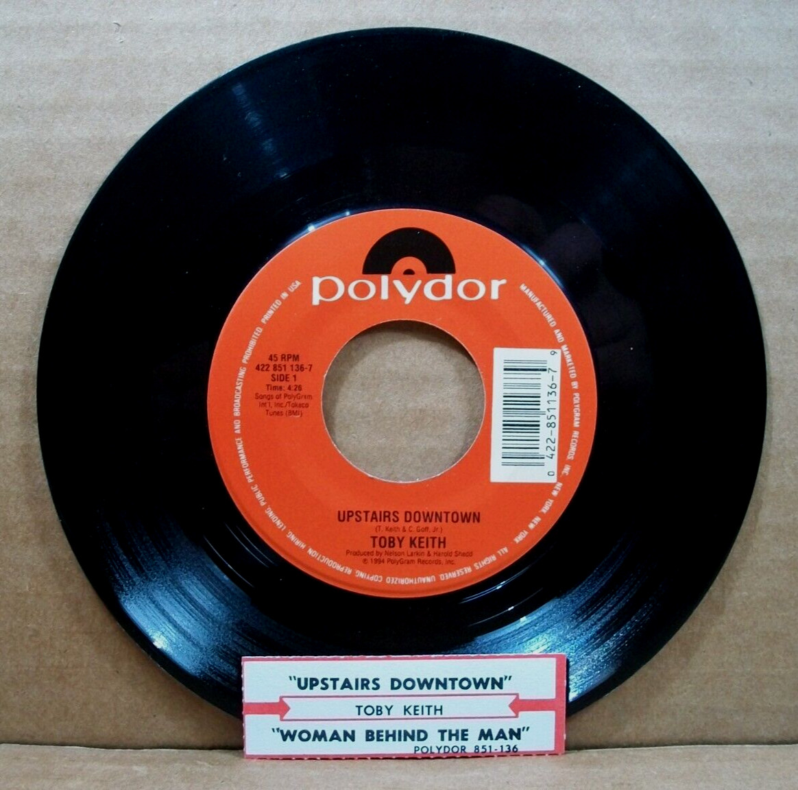 Toby Keith – Upstairs Downtown/Woman Behind The Man (45 RPM, 1994, Polydor)