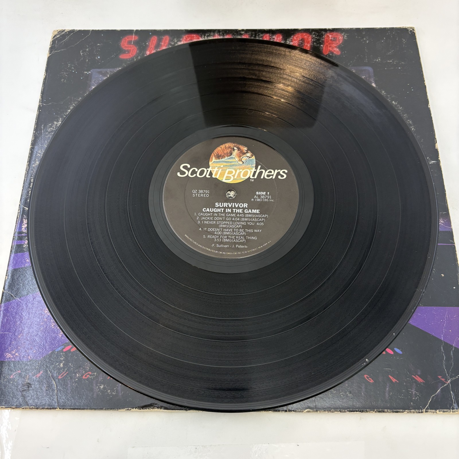 Survivor – Caught In The Game Vinyl LP Very Good Plus (VG+)/Good Plus (G+)
