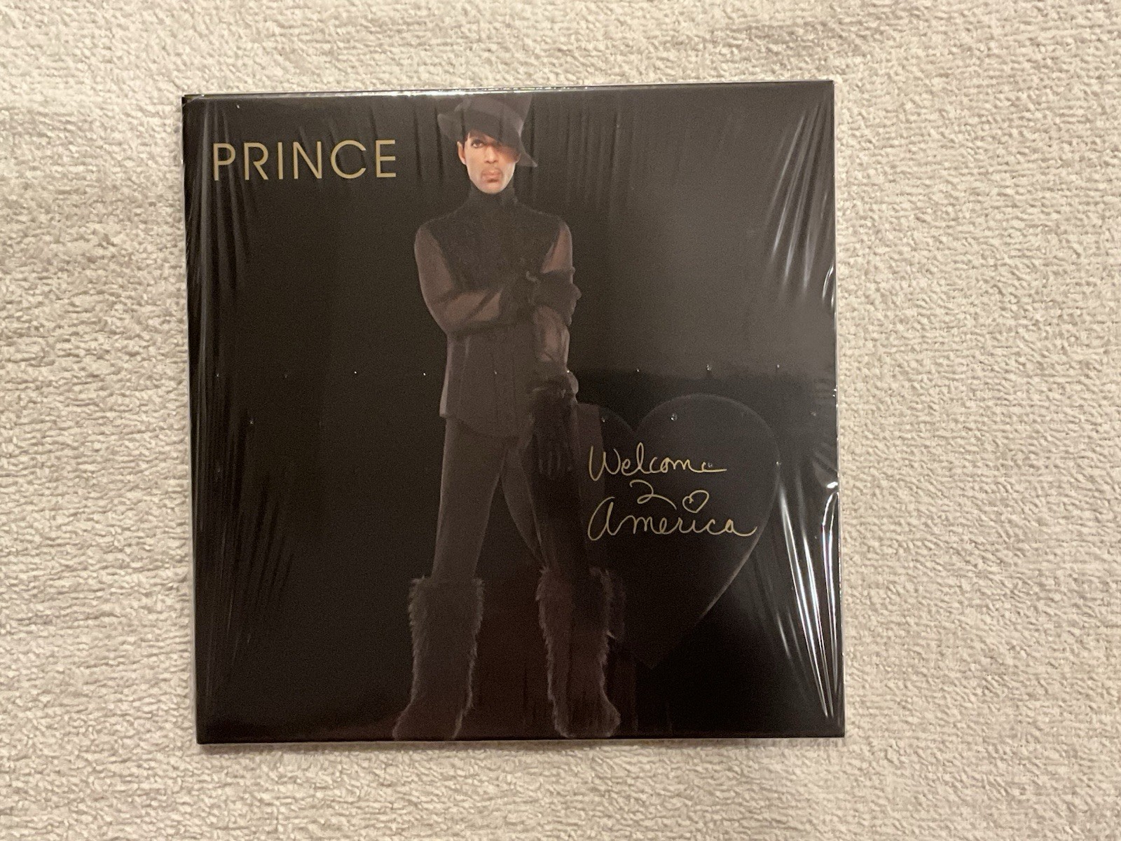 Prince – Welcome 2 America – limited edition 7″ gold vinyl #005528 SEALED COPY