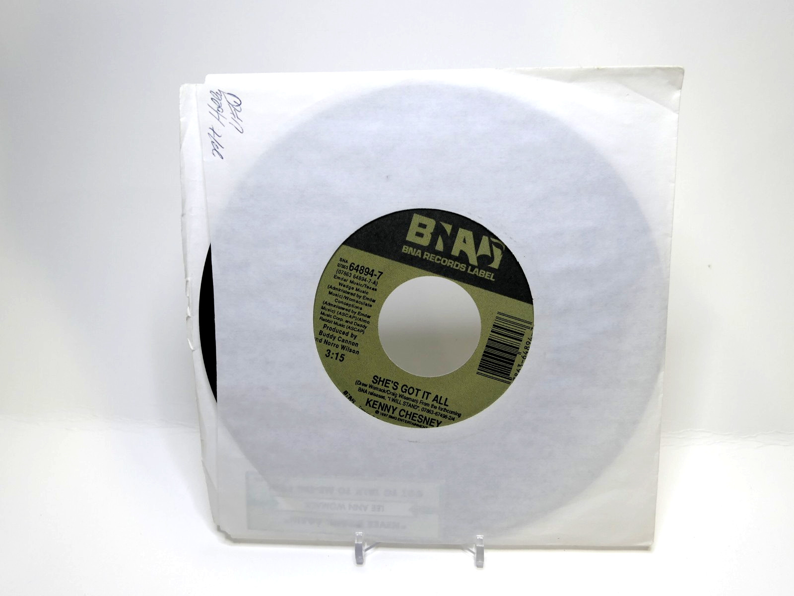 Kenny Chesney – She’s Got It All / 1997 64894-7 Vinyl, 7″, 45 RPM, Single EX